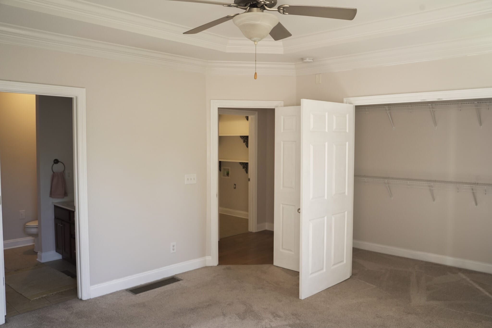 Primary Bedroom #1 looking into Master Bath, Hallway, Laudary Room and Walk-in Closet - 393 Hays Blvd