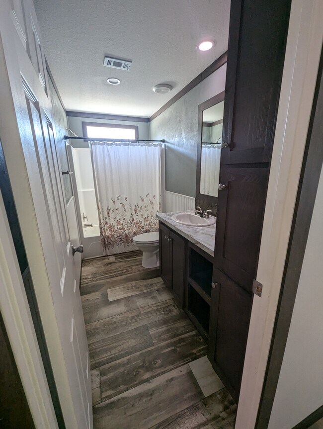 Guest Bathroom built in storage, shower/tub combo - 179 Davis Rd