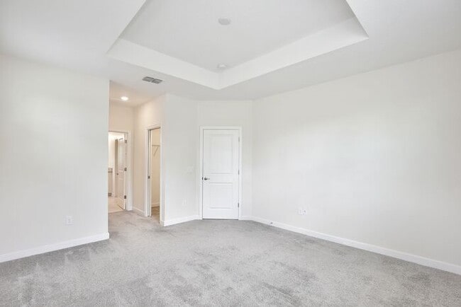 Building Photo - Beautiful 4/3.5 Townhome with a Spacious 2 Car Garage Located in Trails at Moss Park - Orlando
