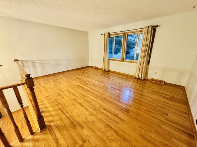 Building Photo - "Charming 4-Bedroom Home with Granite Elegance & Hardwood Warmth in Savage!"