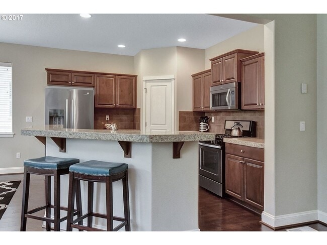 Building Photo - Bright and Open Floor Plan with Fireplace, Attached Garage & Vaulted Ceilings