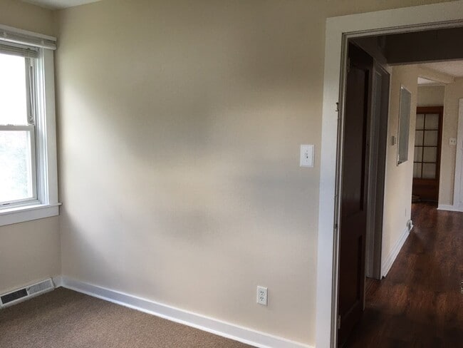 View from 2nd bedroom into hall/living room - 6004 Old Capitol Trl