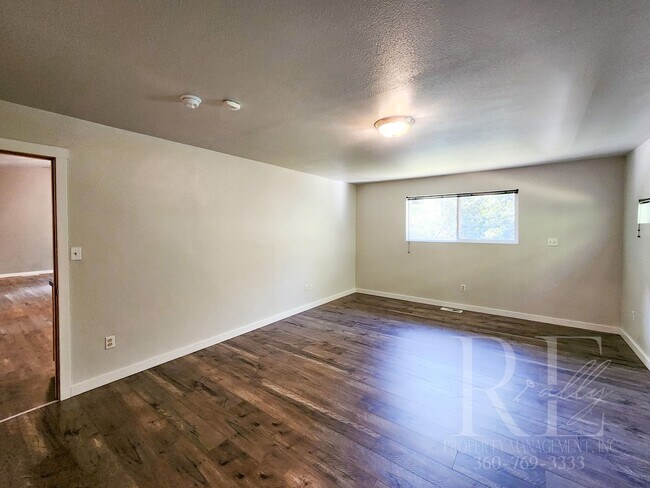 Building Photo - Vaulted Ceilings, Unique Designer Kitchen & Expansive Half-Acre Setting with Flexible Living Spaces