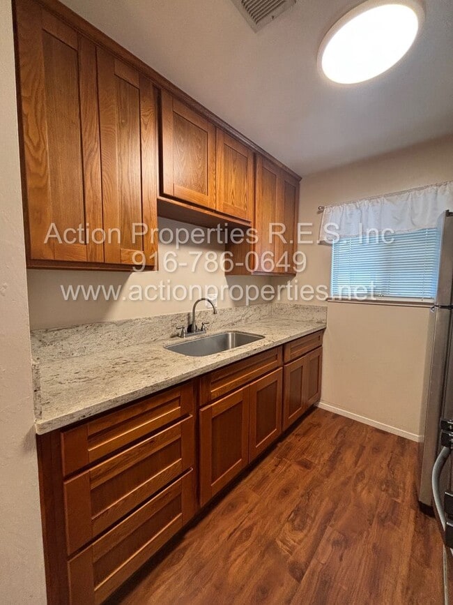 Building Photo - Action Properties RES Inc: offering Availabilities Roseville Greens Condo, single level 2 bedroom...