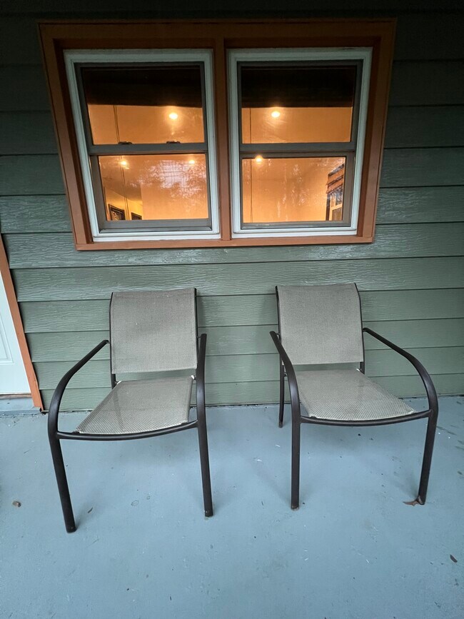 Covered porch has space for lounging. - 73 Swannanoa Ave