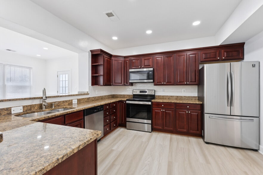 Kitchen with Lots of Storage and Granite Counters - 10828 Miller Rd