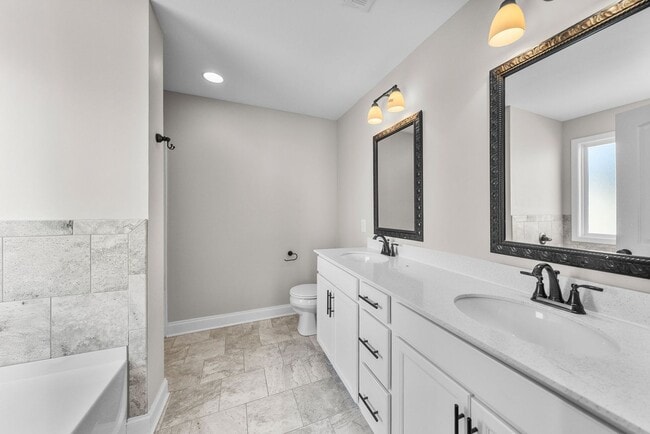 Building Photo - Pet Friendly Three Bedroom with Bonus!