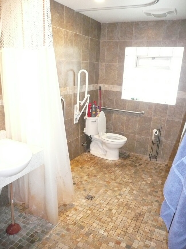 accessible bathroom with roll in shower - 2909 S 76th St