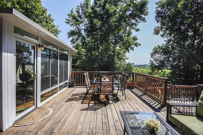 Photo 28. Sunroom opens out to the deck - 1623 Lethia Dr