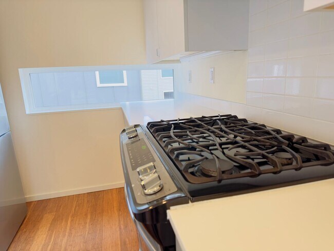 Building Photo - 3 Bedroom Central District Townhome w/ Garage, AC & Rooftop Deck