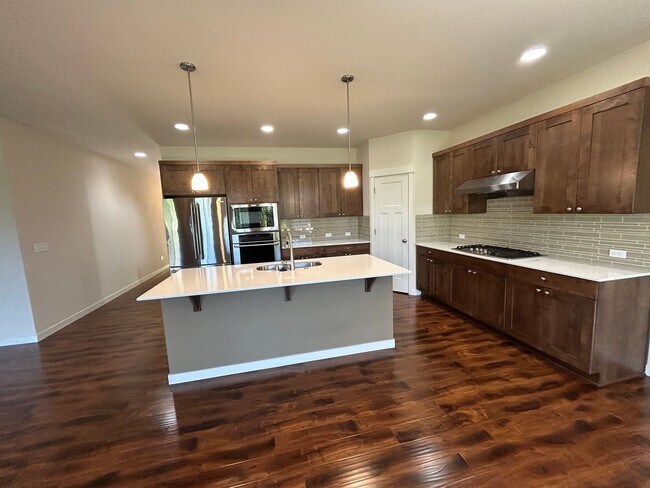 Building Photo - 4 bed/2.5 bath and 3 car garage and a down...