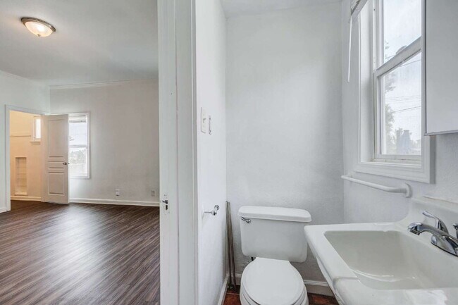 Building Photo - Stylishly Renovated Retro Duplex in the He...