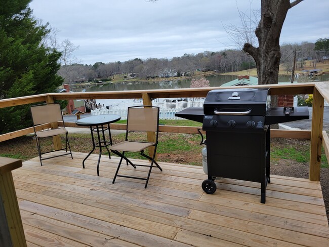 Deck with bistro tables and chairs, and gas grill - 106 Mountain Shore Dr