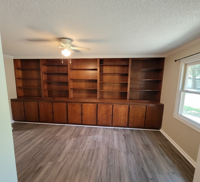 Building Photo - Corner Lot Charm: Spacious 4 Bed on Corner Lot w/ Custom Bookshelves & Private Storage Shed