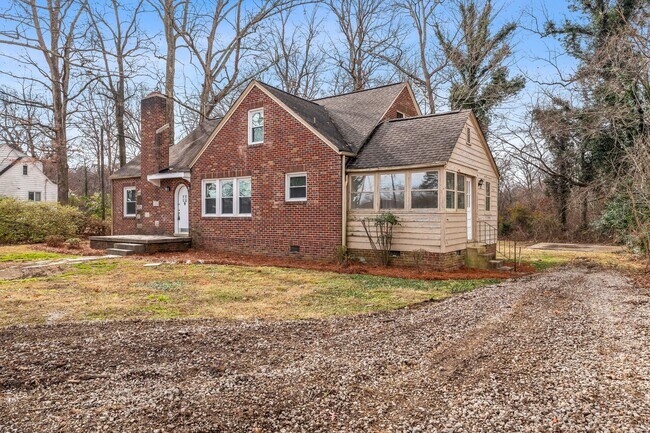 Building Photo - SW, Large Brick Two Bedroom PLUS Two Sun-Rooms, Hardwoods, LR & Separate DR, Fire Place!