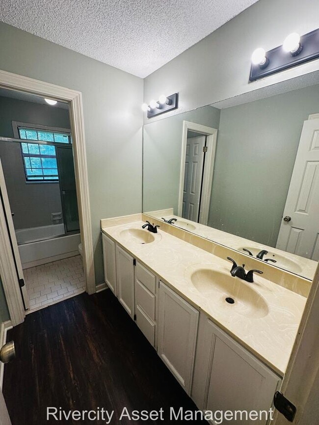 Building Photo - charming three-bedroom, two-full-bath resi...