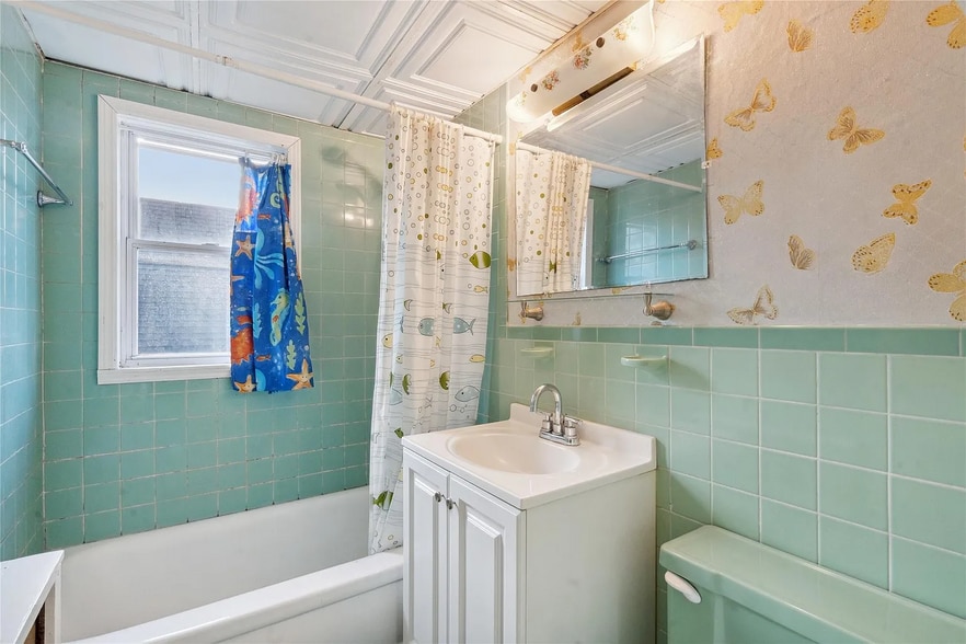 Bathroom being renovated to have white walls replacing the wallpaper. - 316 New Hyde Park Rd