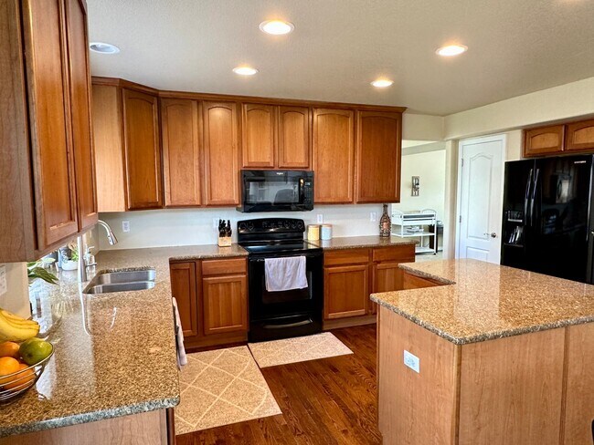 Building Photo - Elegant & Spacious 4BD Home with 3-Car Gar...