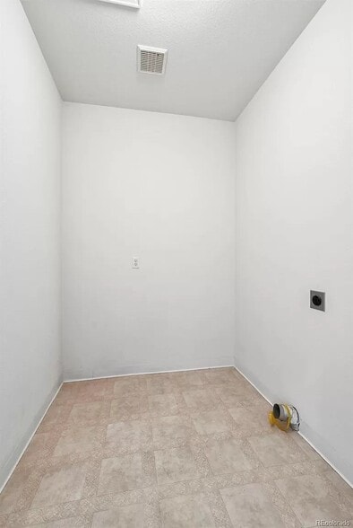 Main floor laundry room - 2408 W 107th Dr