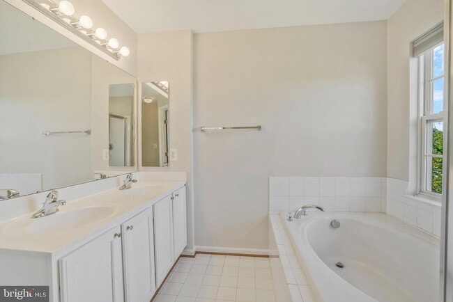 Building Photo - This beautifully maintained brick-front, three-level townhome is located in a highly sought-after...
