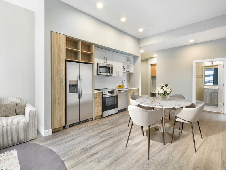 Contemporary kitchens feature stainless steel appliances, quartz countertops, open shelving, and curated finishes designed to suit your lifestyle. - Modera McGavock