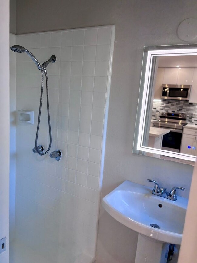 Building Photo - Available Now | 2 Bedroom, 2 Bathroom Townhouse with 1 Assigned Parking Stall at Tropic Gardens 1