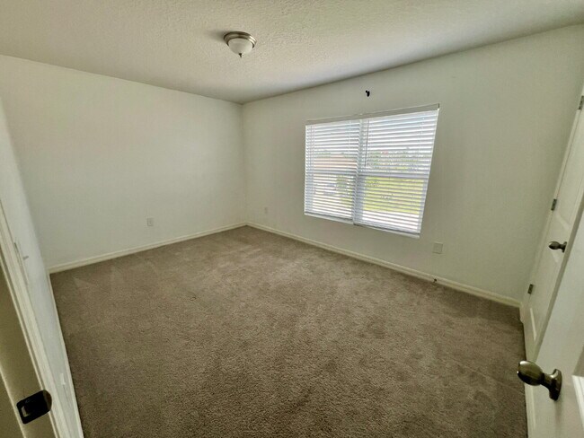 Building Photo - Spacious 4-Bedroom Home with Primary Suite...