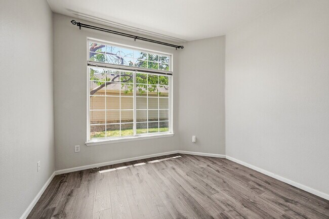 Building Photo - $1,745.95 - Ground-Level 1 Bed + Flex Room | 1.5 Bath Condo with Community Pool