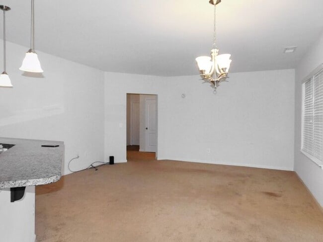 Building Photo - Pet Friendly Condo with Deck and 1 Car Garage