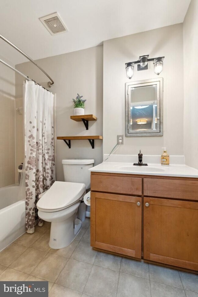 Building Photo - Welcome to this beautifully updated three ...