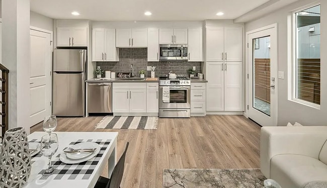 Building Photo - Contemporary 2-Bed Townhome with Rooftop D...