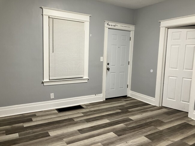 Doors to front porch and front bedroom from l iving room - 256 Weyl St