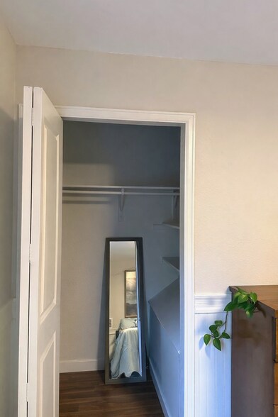 Second bedroom with large closet and sliding doors to a private deck. - 524 Superior St