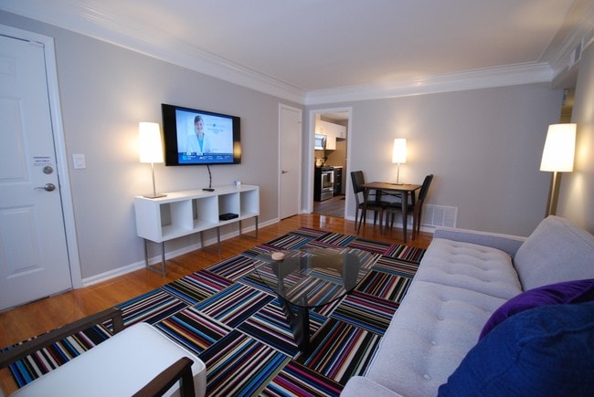 Brookwood Courtyard Condos - Stylish Living Room with 50-inch LED TV - Furnished 2BR/1BA Apts. (NTLY/WKLY/MTHLY)