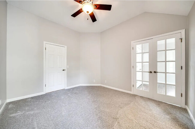 Master bedroom showing walk in closet door and French door entry to 2nd bedroom/office/nursery - 129 Cherry Hill Dr