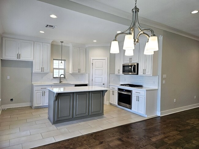 Building Photo - Stunning 4-Bedroom Waterfront Home with Granite Countertops and Hardwood Floors in The Sanctuary ...