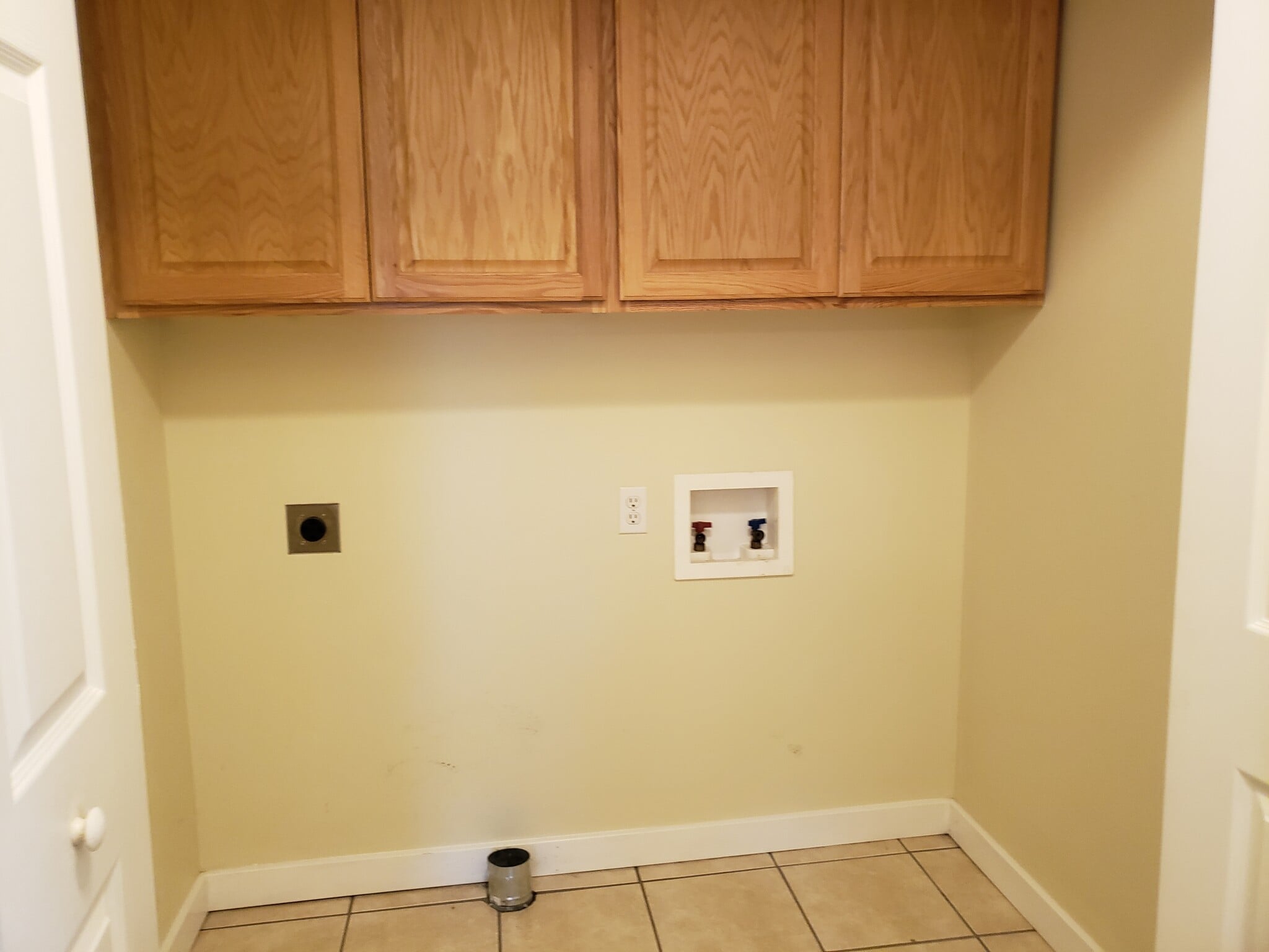 Laundry hookups with cabinet storage - 2977 West Village Lane