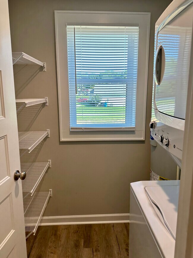 Laundry with window, shelving - 2304 Belle Ave NE