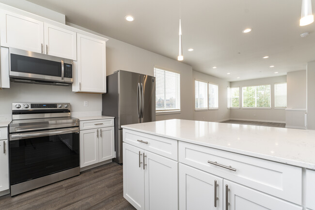 Kitchen, Quartz Countertops, Living Room - The Two-Ten Townhomes