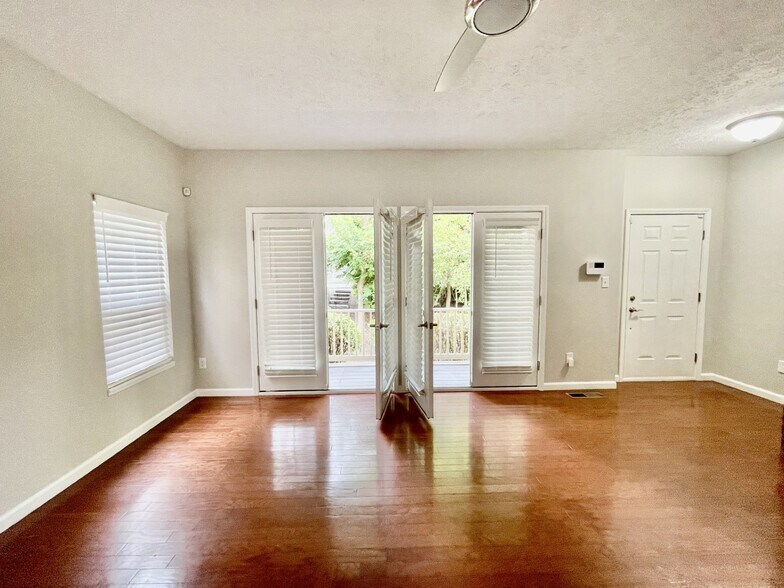 living room with french doors - 6143 Halton Pl