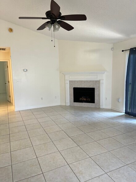Open-layout living room with fireplace. - 5374 Lacy Jane Way
