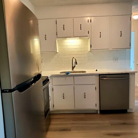 Kitchen white cabinets with chrome hardware - 49 Spencer Rd
