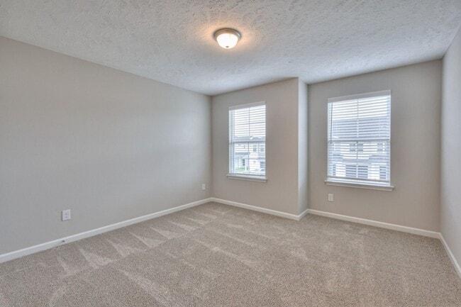 Building Photo - Brand New Luxury Townhome! 3 BR, 2.5 BA, 2 Car Garage, Pool, Dog Park, and More!