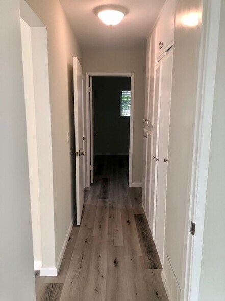 Hallway with Closets to Front Bedroom - 16181 Ganges Lane #2, Huntington Beach, CA 92647