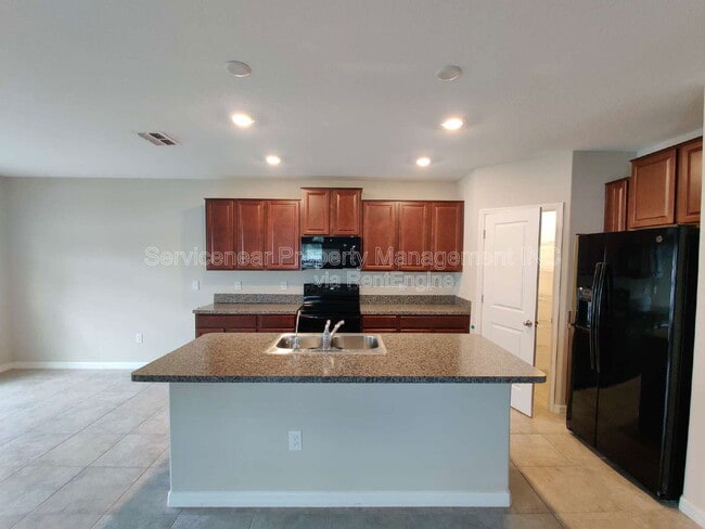 Building Photo - 7408 French Marigold Ave.