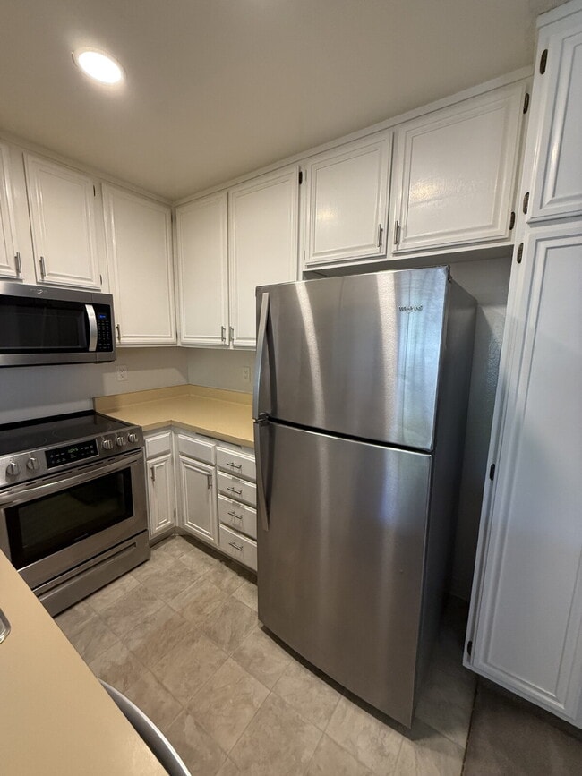 Building Photo - Spacious 3-Bedroom, 2-Bath Multi-Level Home with Balcony, In-Unit Laundry & Dual Parking