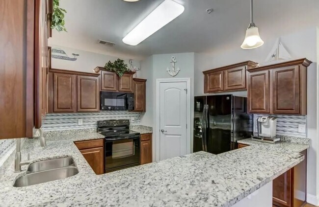 Building Photo - Dive Into Your New Oasis!
