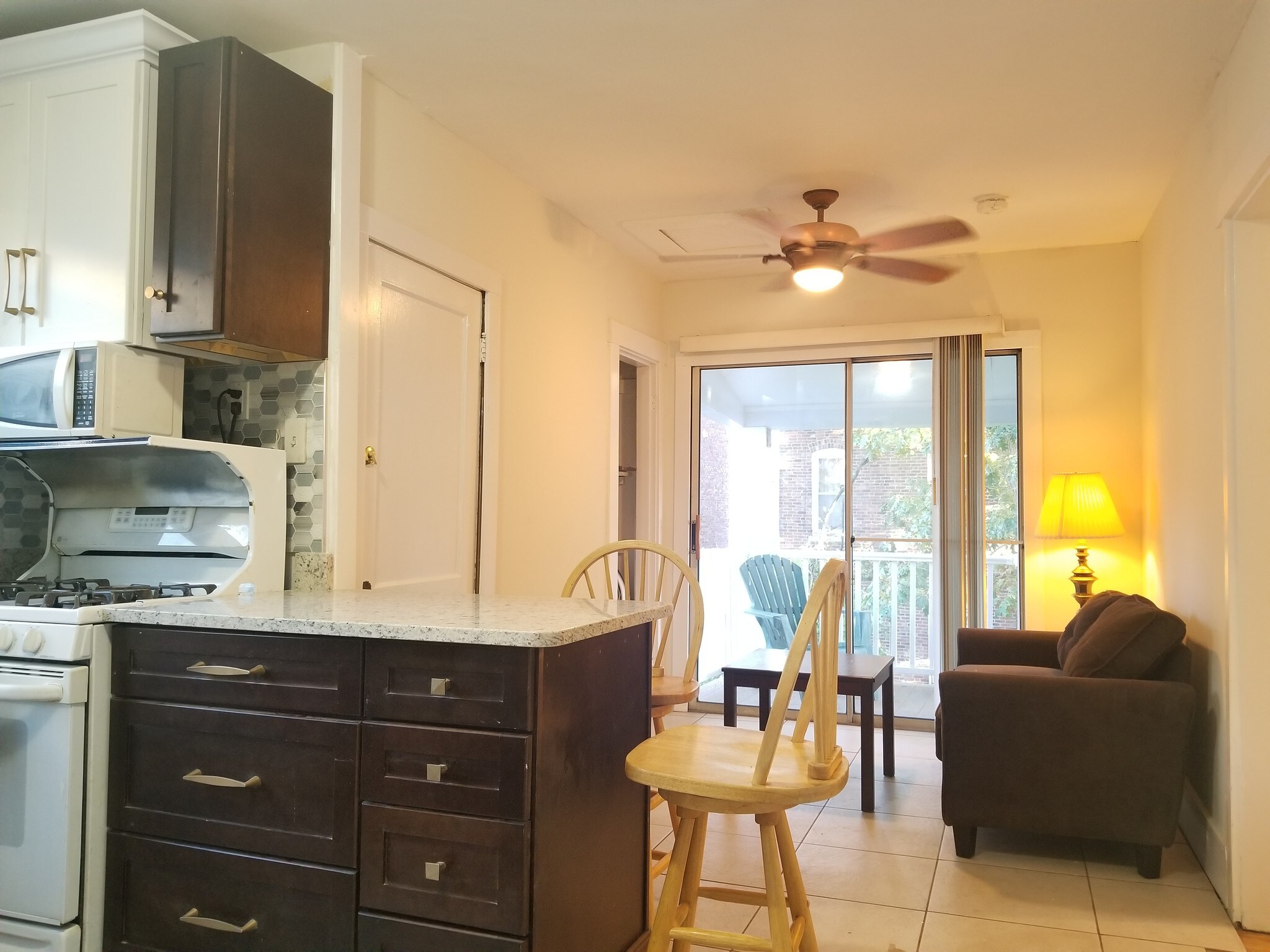 open kitchen with living room leading to deck - 61 Hooker St