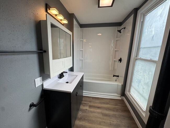 Building Photo - Spacious 4-Bedroom Home with Porch, Deck and Fenced Yard!