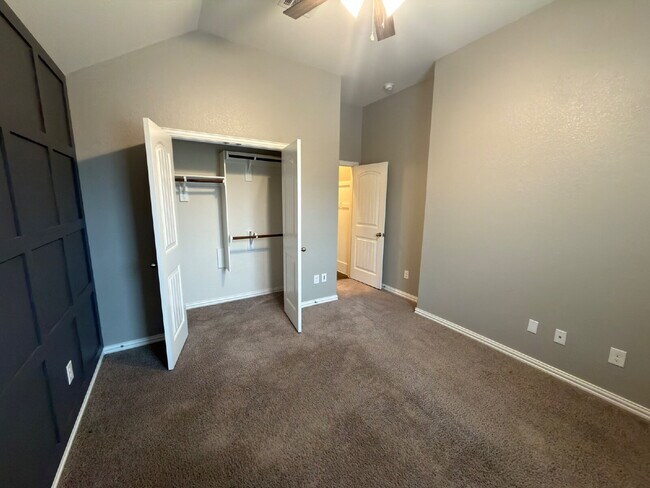 Building Photo - Four bed two bath on a corner lot with a pool in Sunfield. Gas cook top, double ovens. Open kitch...